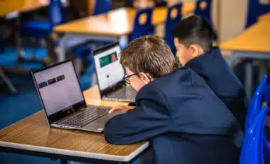 St. Bede's pupils with computers in the classroom
